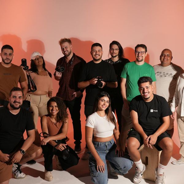 A diverse group of people practicing yoga together in a bright, modern studio.